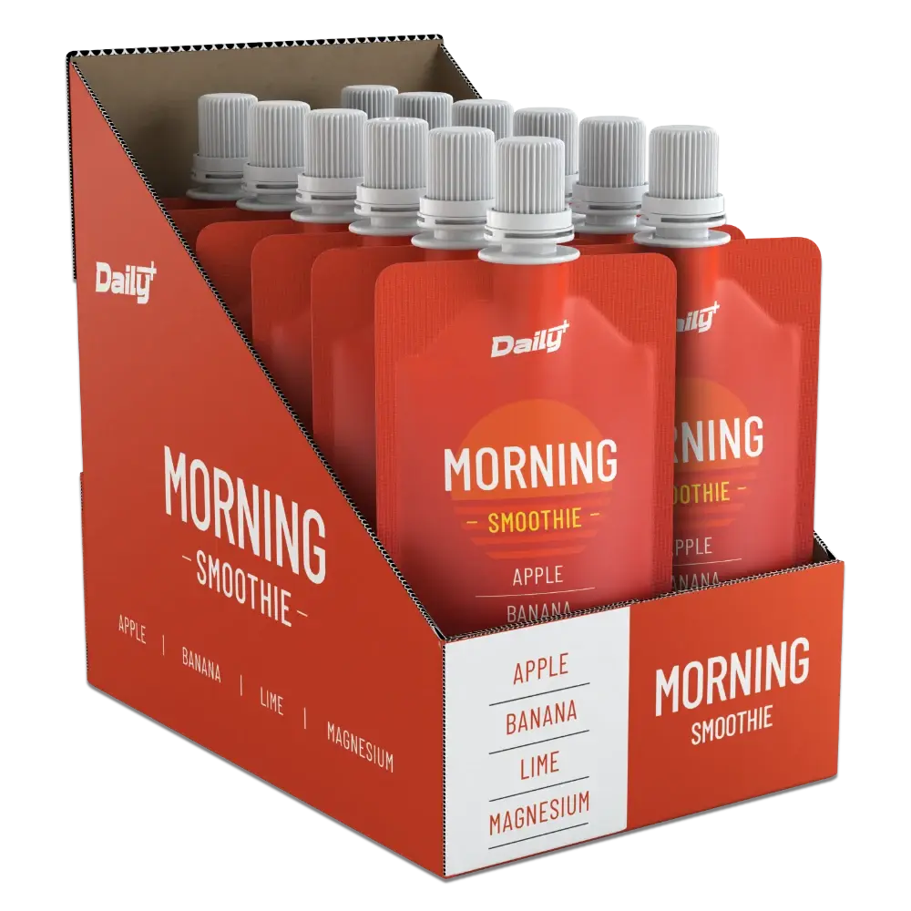 Display carton of 12 pcs. Daily+ Morning Smoothie pouches in a cardboard box on a white background