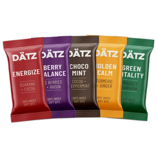 Five Dätz bars in different flavors on a white background.